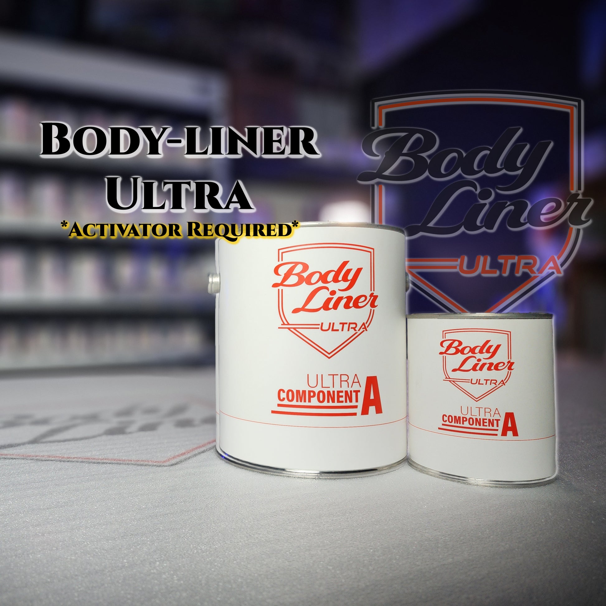 Two cans of Body Liner Ultra paint with a blurred background